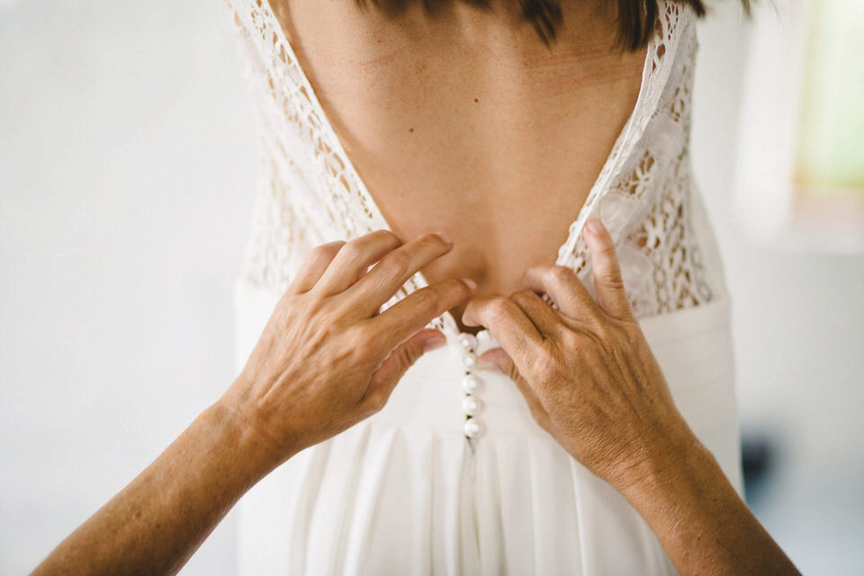 Emmanuelle wore a dress she designed herself for her chic and boho-luxe style French Chateau wedding. Photography by Joseph Hall.