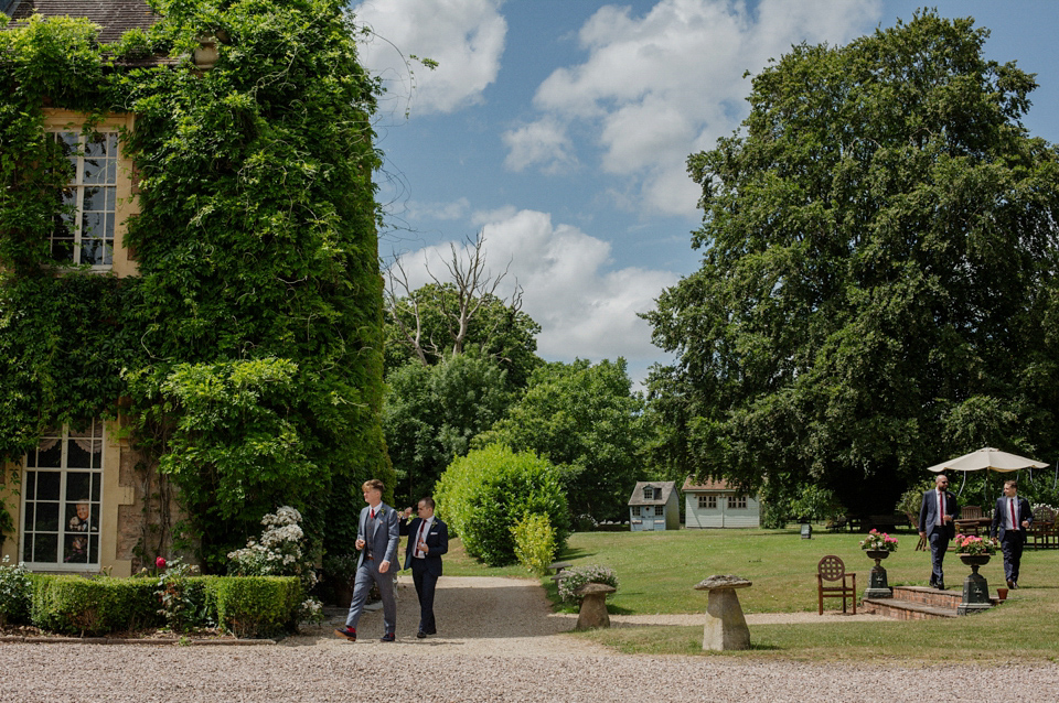 Bride Alex wore a Hermione de Paula gown for her modern, quirky wedding at Maunsel House in Somerset. Photography by Karolina of Hearts on Fire.