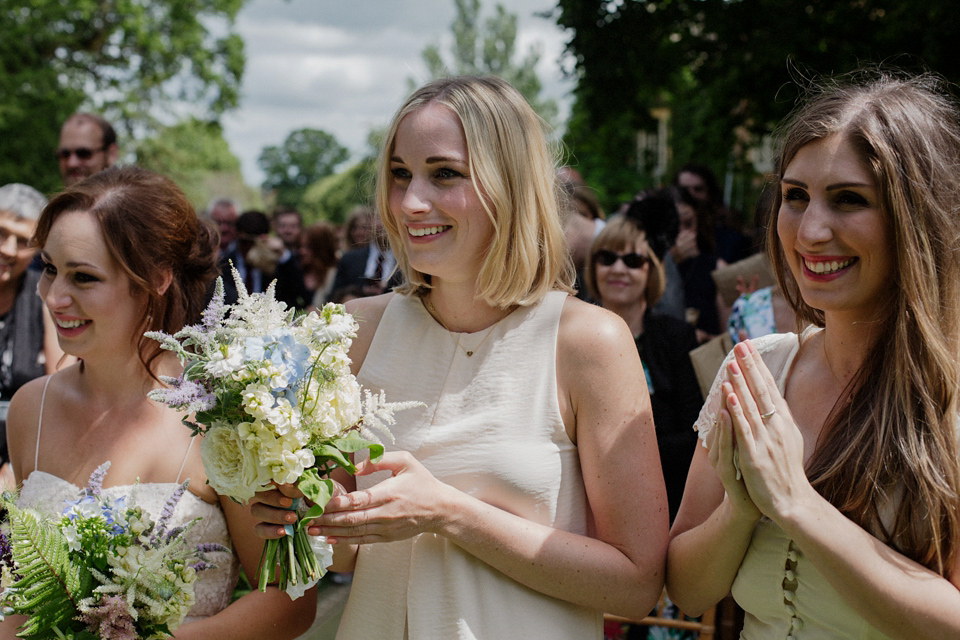 Bride Alex wore a Hermione de Paula gown for her modern, quirky wedding at Maunsel House in Somerset. Photography by Karolina of Hearts on Fire.