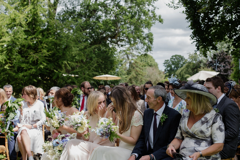 Bride Alex wore a Hermione de Paula gown for her modern, quirky wedding at Maunsel House in Somerset. Photography by Karolina of Hearts on Fire.