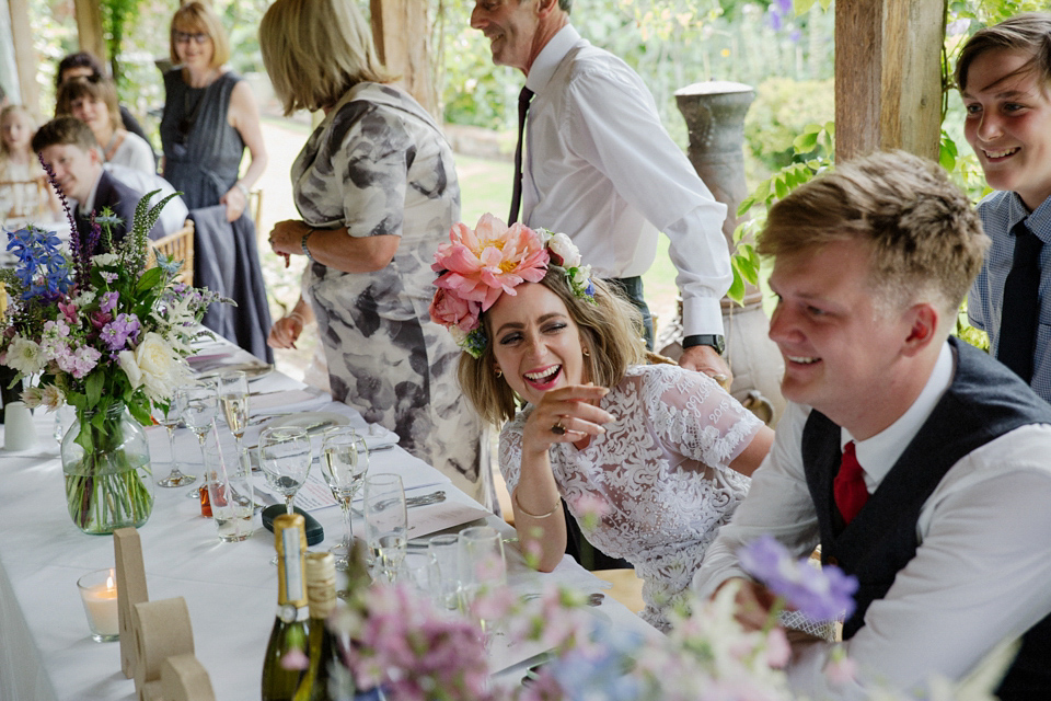 Bride Alex wore a Hermione de Paula gown for her modern, quirky wedding at Maunsel House in Somerset. Photography by Karolina of Hearts on Fire.