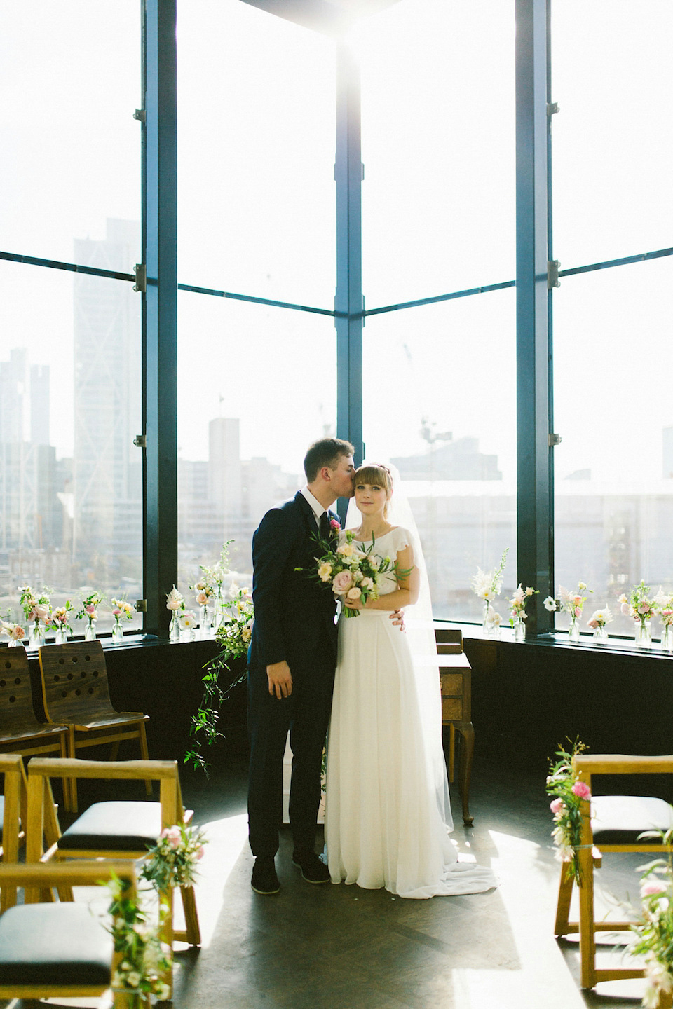 Bride Carly wears a Belle & Bunty gown for her cool East London wedding at the ACE hotel, Shoreditch. Photography by Alain M.