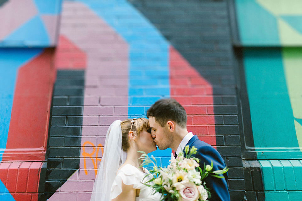 Bride Carly wears a Belle & Bunty gown for her cool East London wedding at the ACE hotel, Shoreditch. Photography by Alain M.