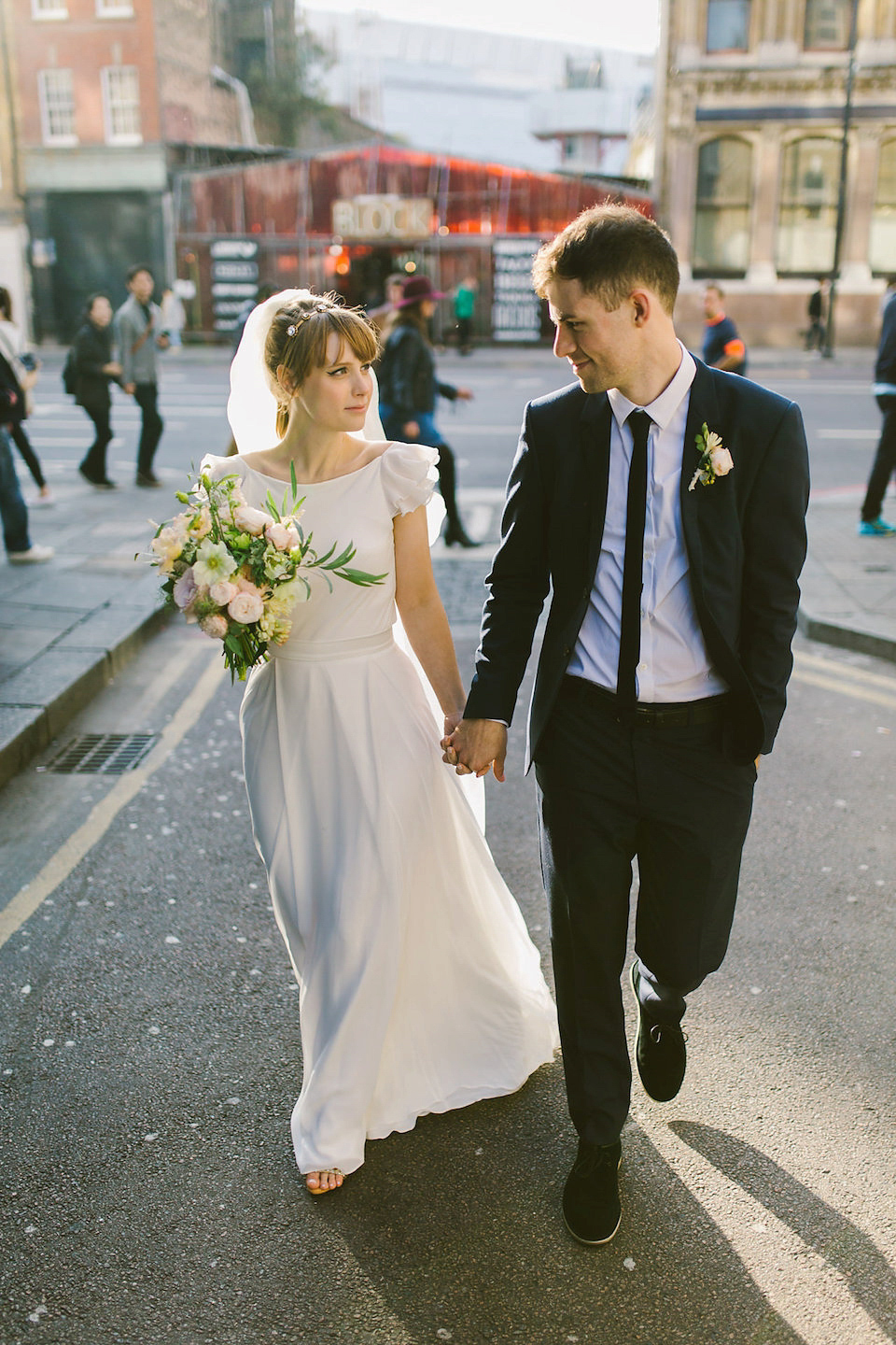 Bride Carly wears a Belle & Bunty gown for her cool East London wedding at the ACE hotel, Shoreditch. Photography by Alain M.