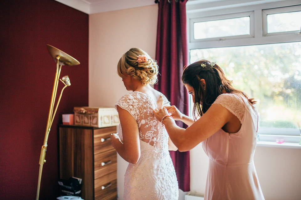 Bride Sam wore a Maggie Sottero gown for her romantic Suffolk country pub wedding. Photography by Emily Tyler.