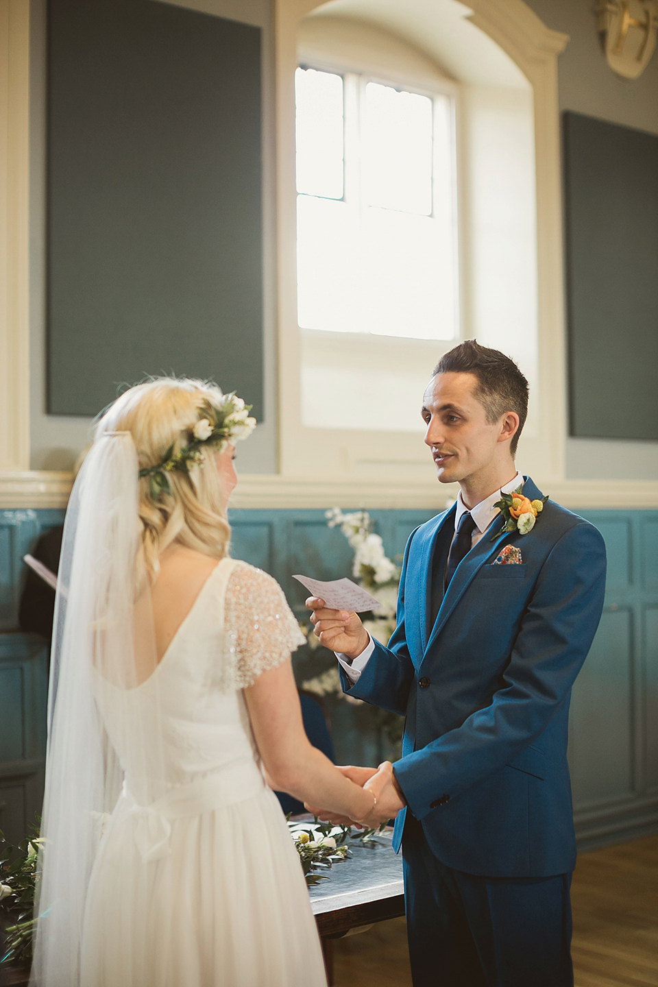 Bride Kate wears a Grace Loves Lace gown for her colourful and Fiesta inspired village hall wedding. Photography by Tom Ravenshear.