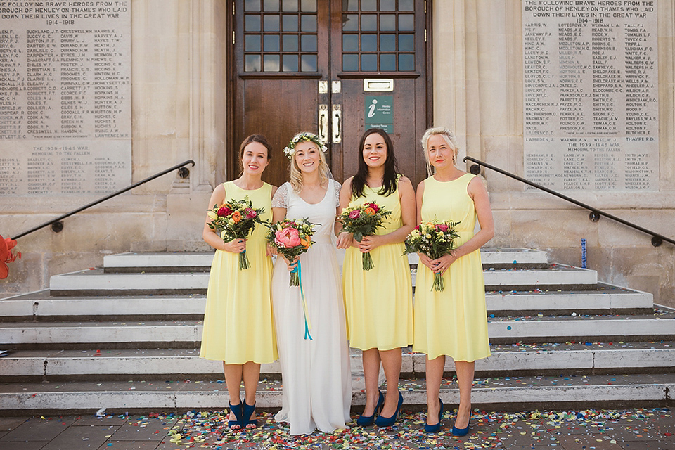 Bride Kate wears a Grace Loves Lace gown for her colourful and Fiesta inspired village hall wedding. Photography by Tom Ravenshear.