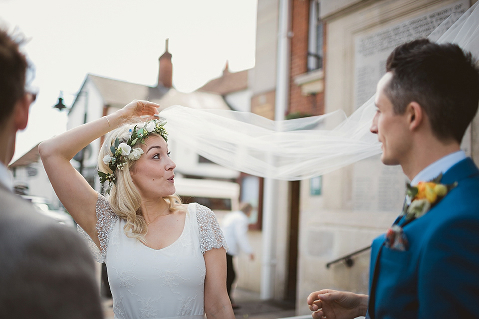 Bride Kate wears a Grace Loves Lace gown for her colourful and Fiesta inspired village hall wedding. Photography by Tom Ravenshear.