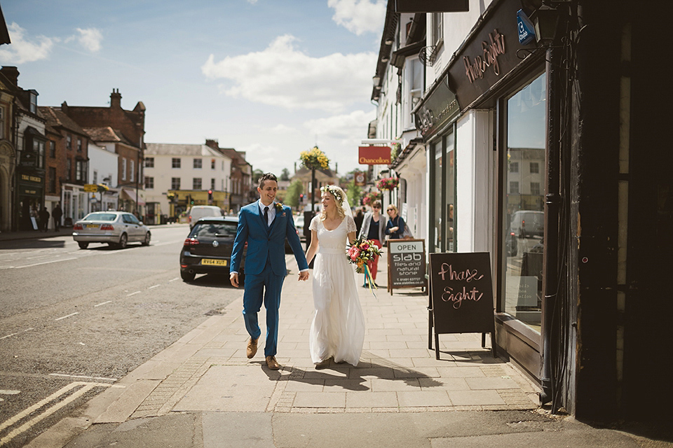 Bride Kate wears a Grace Loves Lace gown for her colourful and Fiesta inspired village hall wedding. Photography by Tom Ravenshear.