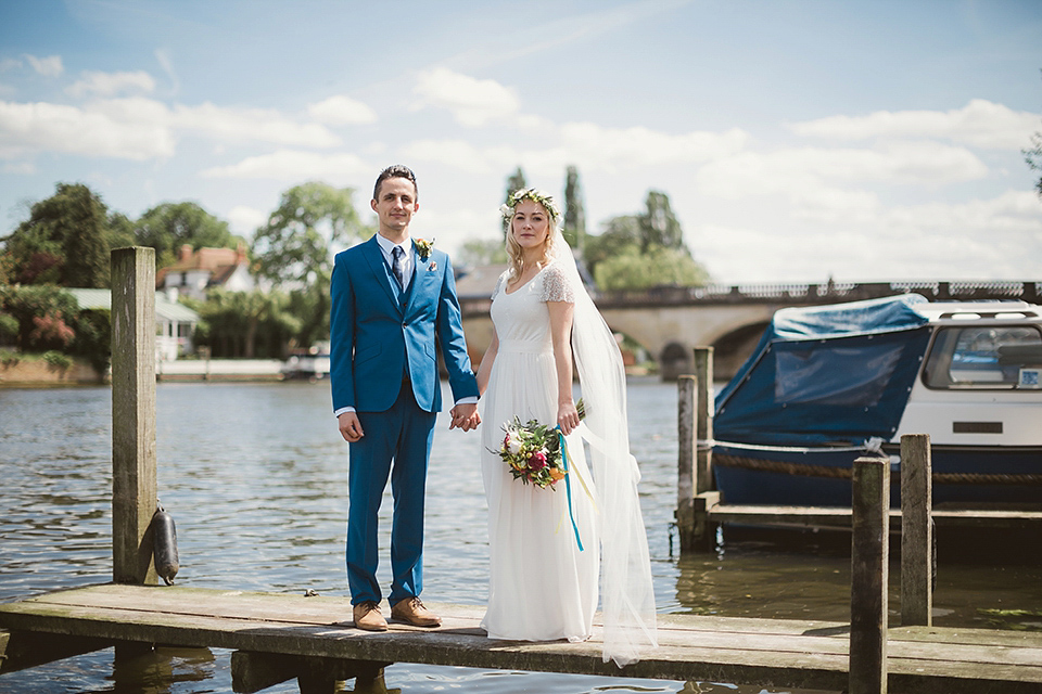 Bride Kate wears a Grace Loves Lace gown for her colourful and Fiesta inspired village hall wedding. Photography by Tom Ravenshear.