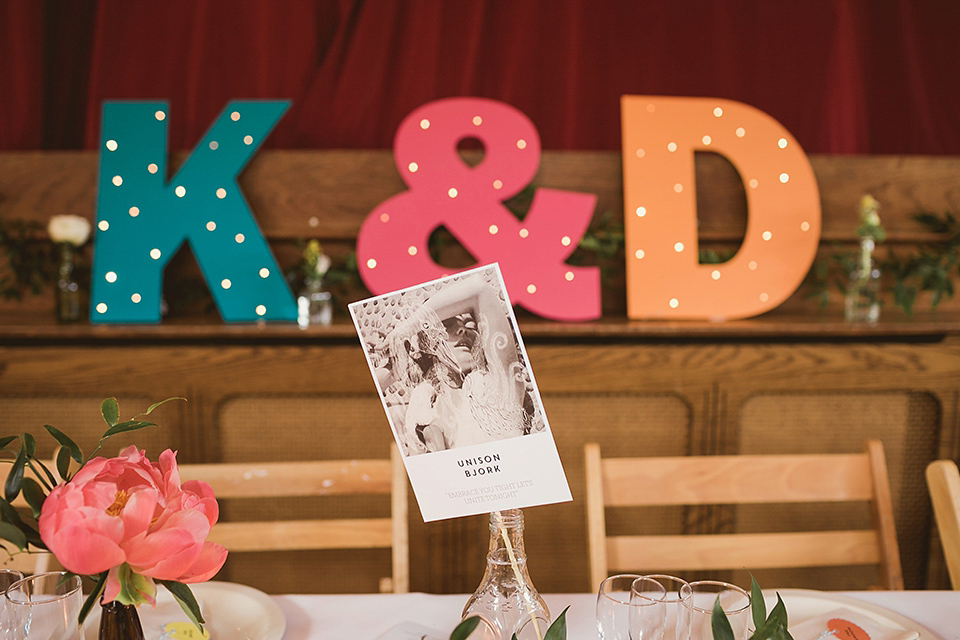 Bride Kate wears a Grace Loves Lace gown for her colourful and Fiesta inspired village hall wedding. Photography by Tom Ravenshear.