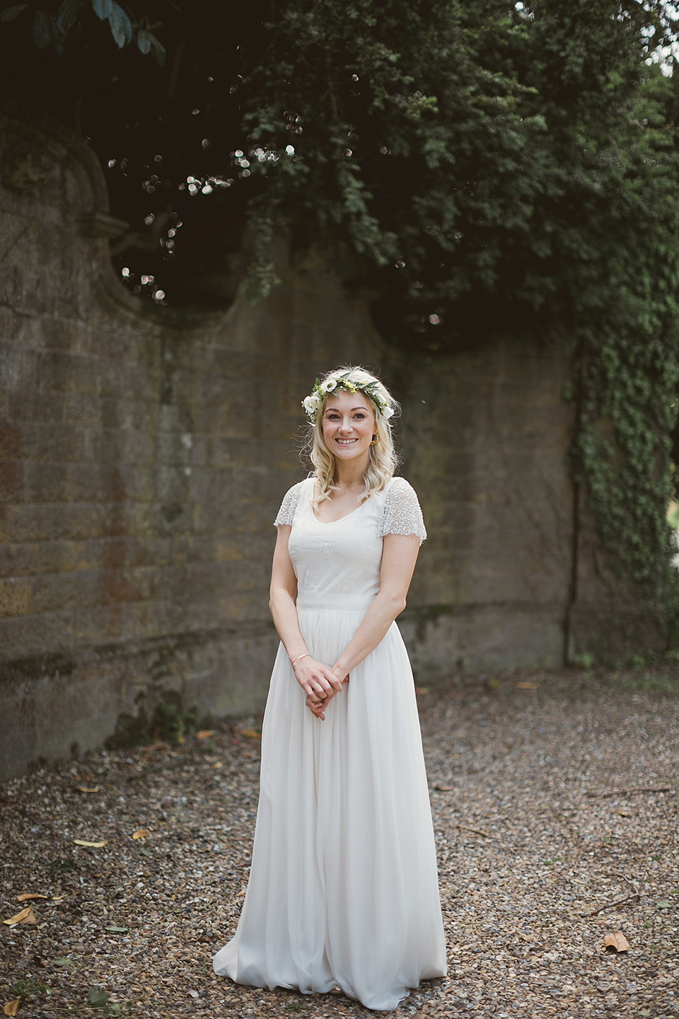 Bride Kate wears a Grace Loves Lace gown for her colourful and Fiesta inspired village hall wedding. Photography by Tom Ravenshear.