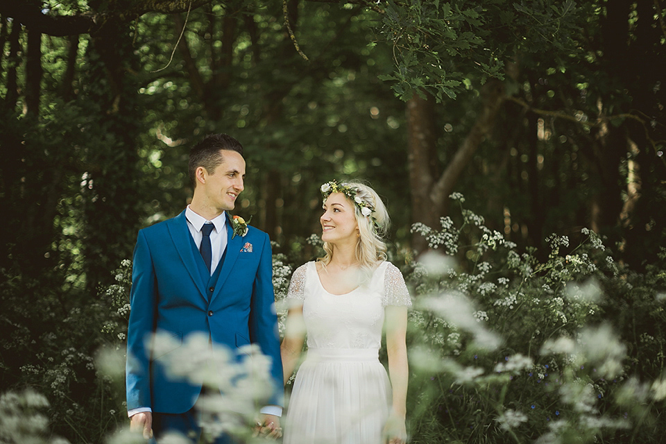 Bride Kate wears a Grace Loves Lace gown for her colourful and Fiesta inspired village hall wedding. Photography by Tom Ravenshear.