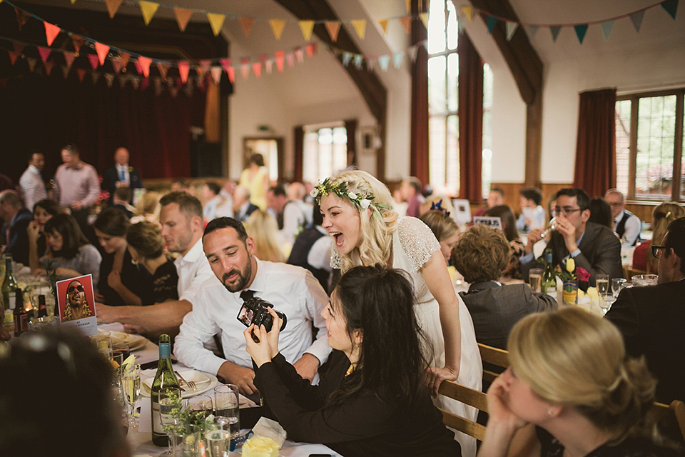 Bride Kate wears a Grace Loves Lace gown for her colourful and Fiesta inspired village hall wedding. Photography by Tom Ravenshear.