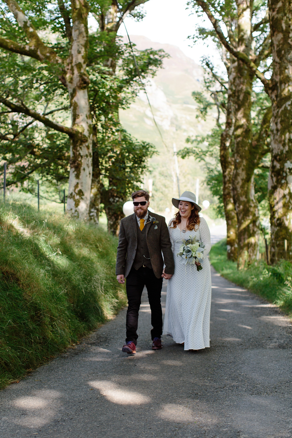 Bride India wears a 1970's inspired gown by Rowanjoy for her Icelandic inspired bohemian and free spirited wedding at Monachyle Mhor in Scotland. Photography by Caro Weiss. Bride India wears a 1970's inspired gown by Rowanjoy for her Icelandic inspired bohemian and free spirited wedding at Monachyle Mhor in Scotland. Photography by Caro Weiss.