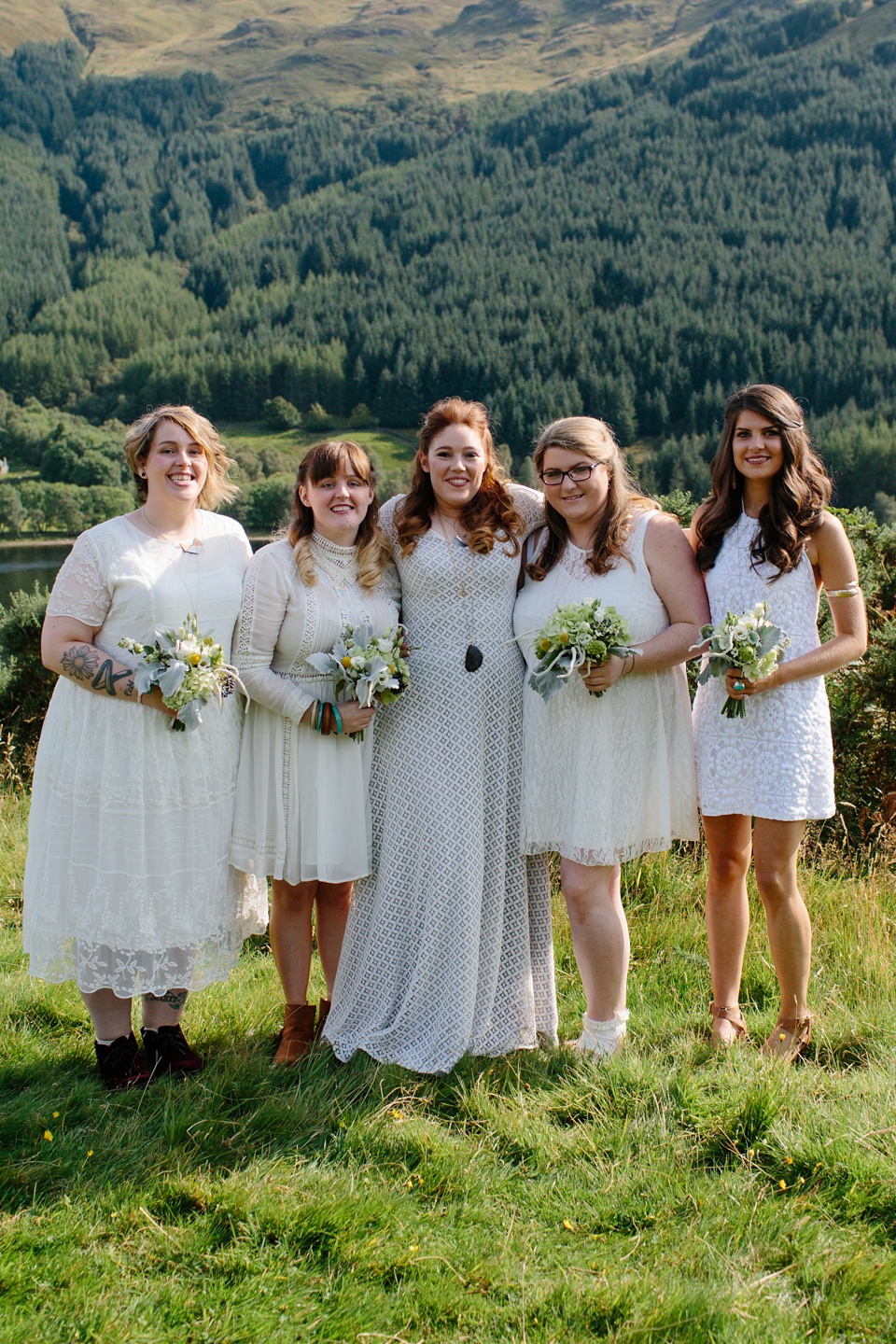 Bride India wears a 1970's inspired gown by Rowanjoy for her Icelandic inspired bohemian and free spirited wedding at Monachyle Mhor in Scotland. Photography by Caro Weiss.