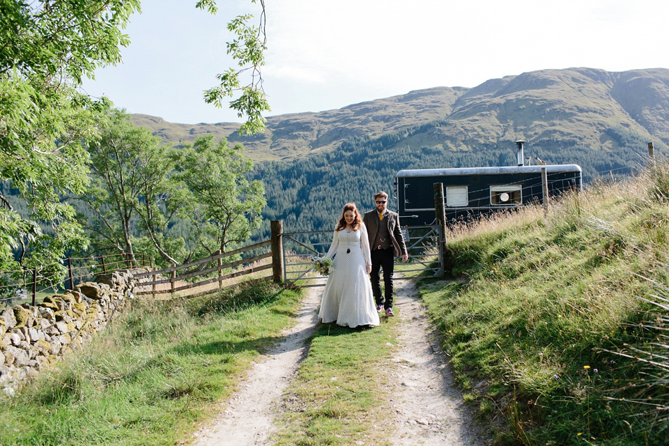 Bride India wears a 1970's inspired gown by Rowanjoy for her Icelandic inspired bohemian and free spirited wedding at Monachyle Mhor in Scotland. Photography by Caro Weiss. Bride India wears a 1970's inspired gown by Rowanjoy for her Icelandic inspired bohemian and free spirited wedding at Monachyle Mhor in Scotland. Photography by Caro Weiss.