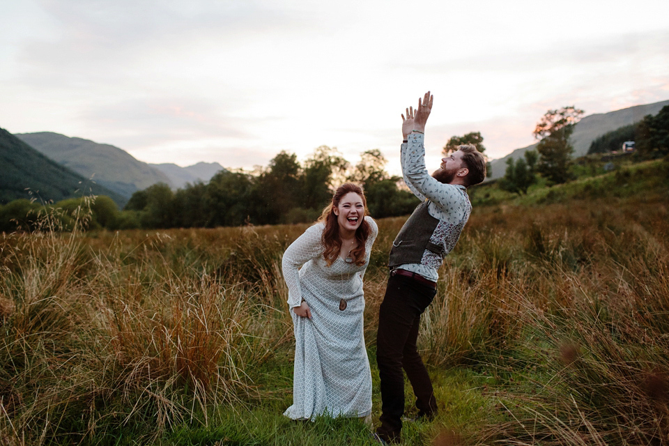 Bride India wears a 1970's inspired gown by Rowanjoy for her Icelandic inspired bohemian and free spirited wedding at Monachyle Mhor in Scotland. Photography by Caro Weiss.