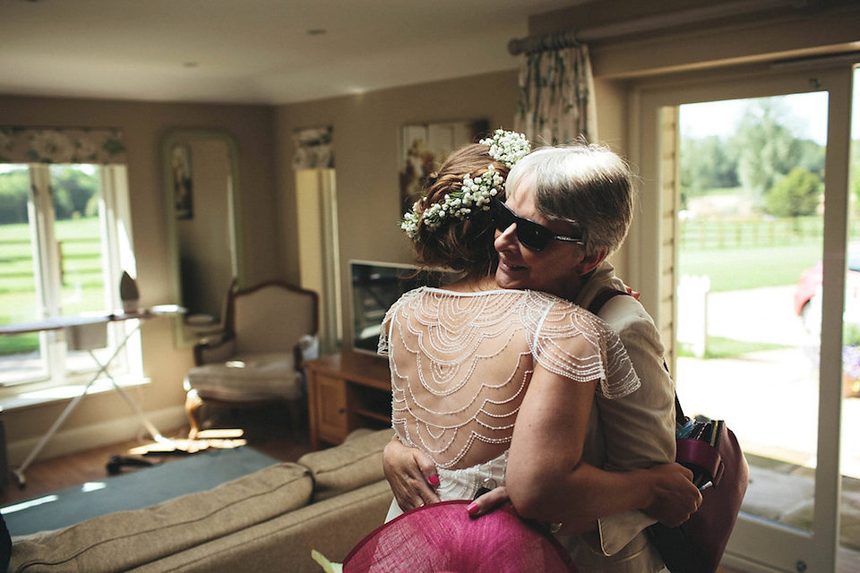 Bride Helen wears a Monsoon wedding dress for her quirky, cloud inspired English garden party wedding. Photography by Red on Blonde.