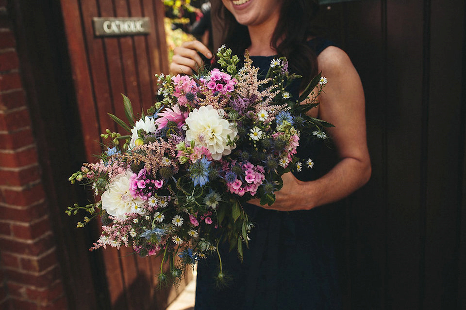 Bride Helen wears a Monsoon wedding dress for her quirky, cloud inspired English garden party wedding. Photography by Red on Blonde.