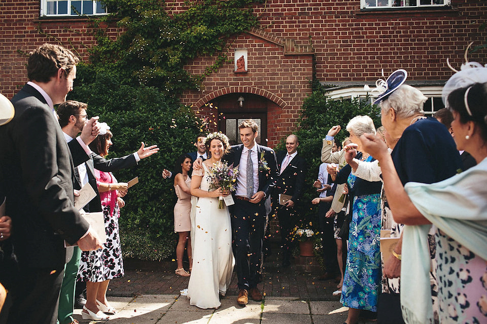 Bride Helen wears a Monsoon wedding dress for her quirky, cloud inspired English garden party wedding. Photography by Red on Blonde.