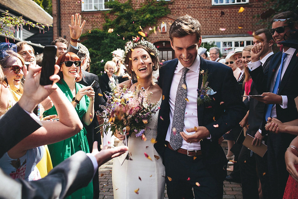 Bride Helen wears a Monsoon wedding dress for her quirky, cloud inspired English garden party wedding. Photography by Red on Blonde.