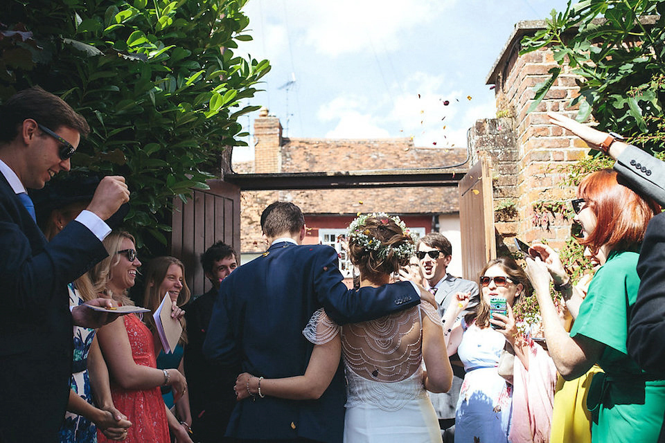 Bride Helen wears a Monsoon wedding dress for her quirky, cloud inspired English garden party wedding. Photography by Red on Blonde.