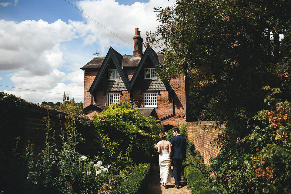 Bride Helen wears a Monsoon wedding dress for her quirky, cloud inspired English garden party wedding. Photography by Red on Blonde.