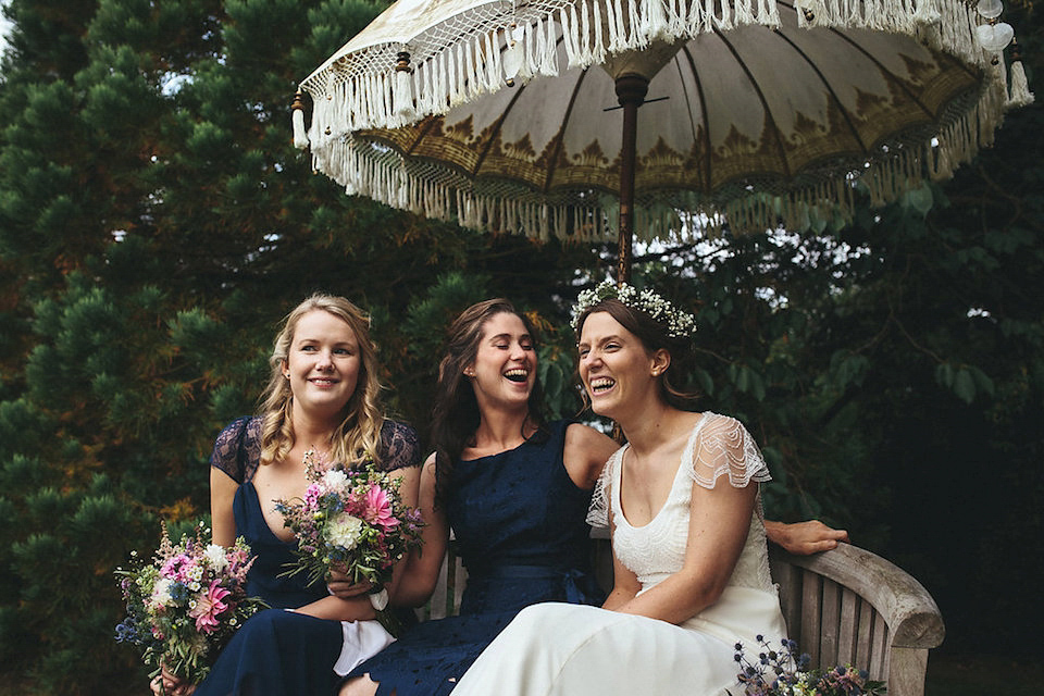 Bride Helen wears a Monsoon wedding dress for her quirky, cloud inspired English garden party wedding. Photography by Red on Blonde.