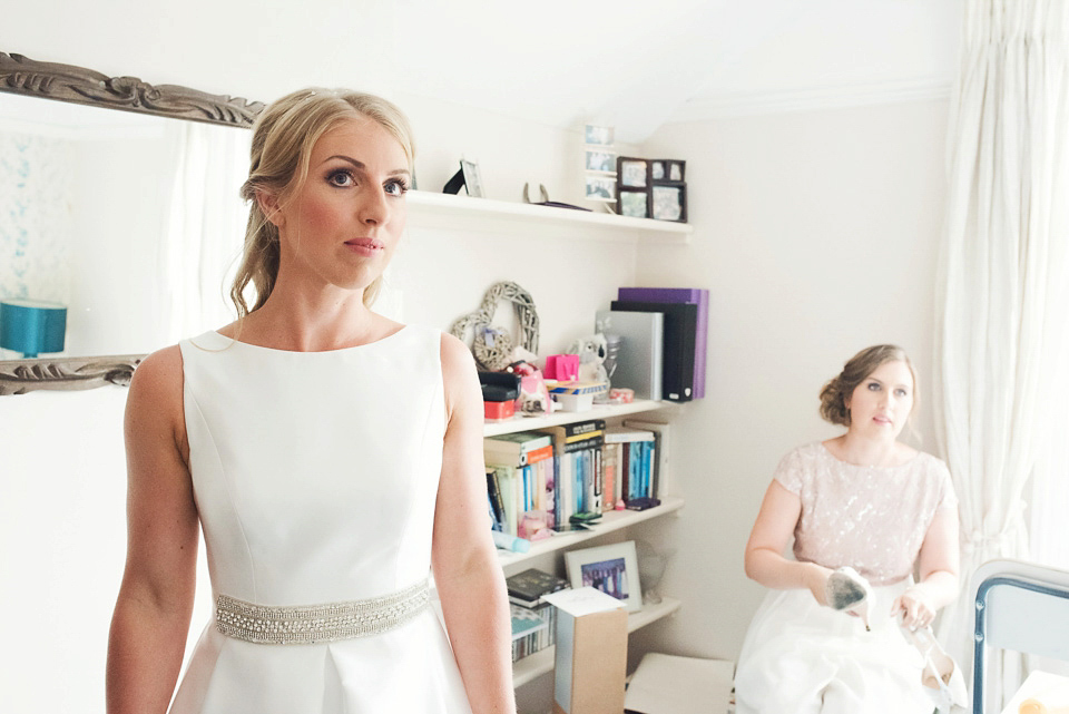 Bride Rosanna wore a Jesus Peiro gown from Miss Bush Bridal in Surrey for her glamorous and romantic English country garden wedding. Photography by Juliet McKee.