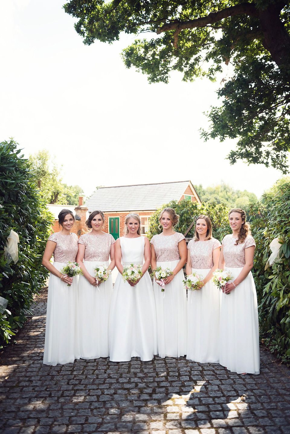 Bride Rosanna wore a Jesus Peiro gown from Miss Bush Bridal in Surrey for her glamorous and romantic English country garden wedding. Photography by Juliet McKee.