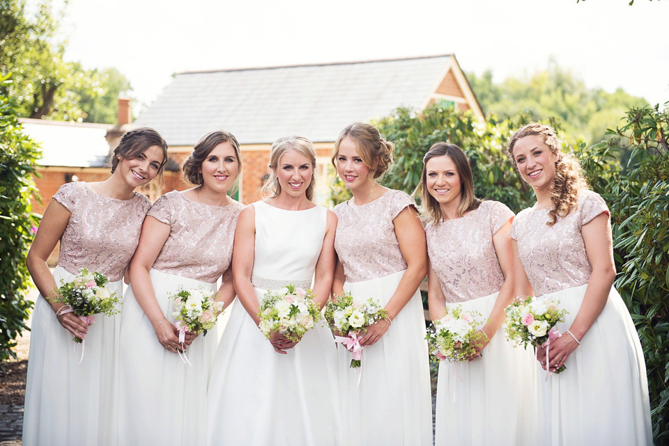 Bride Rosanna wore a Jesus Peiro gown from Miss Bush Bridal in Surrey for her glamorous and romantic English country garden wedding. Photography by Juliet McKee.