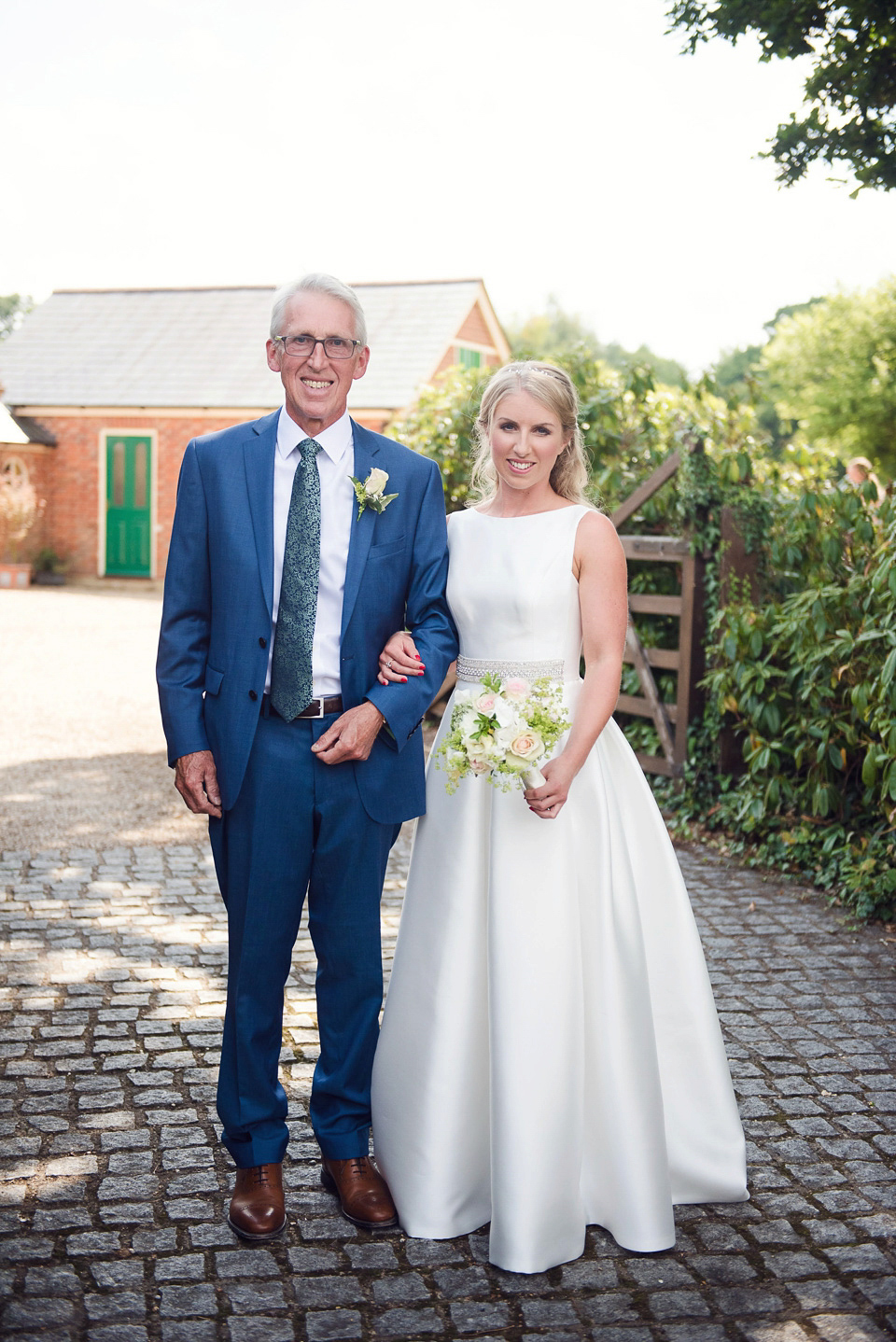 Bride Rosanna wore a Jesus Peiro gown from Miss Bush Bridal in Surrey for her glamorous and romantic English country garden wedding. Photography by Juliet McKee.
