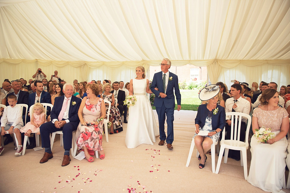 Bride Rosanna wore a Jesus Peiro gown from Miss Bush Bridal in Surrey for her glamorous and romantic English country garden wedding. Photography by Juliet McKee.