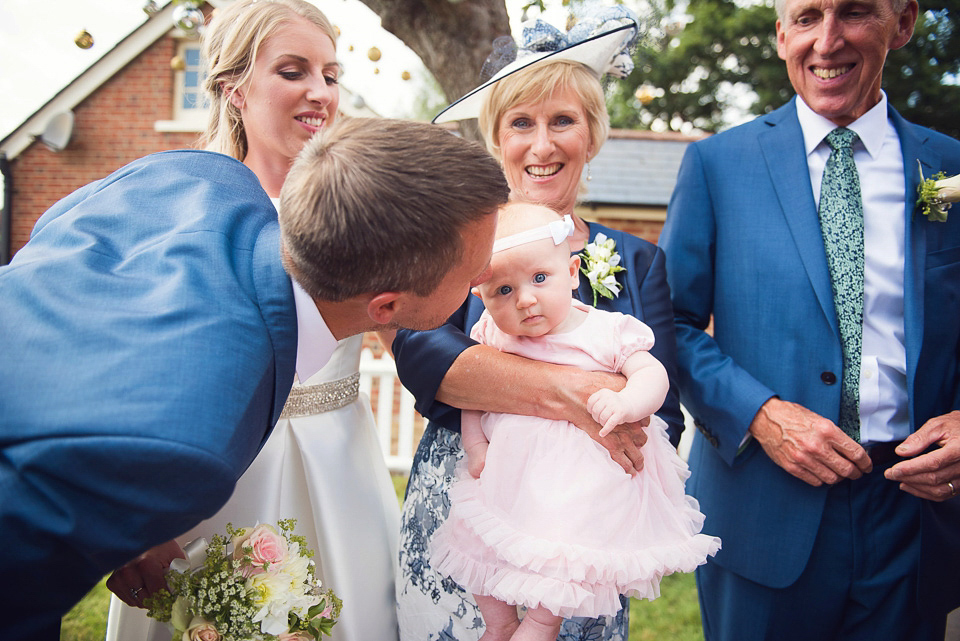 Bride Rosanna wore a Jesus Peiro gown from Miss Bush Bridal in Surrey for her glamorous and romantic English country garden wedding. Photography by Juliet McKee.