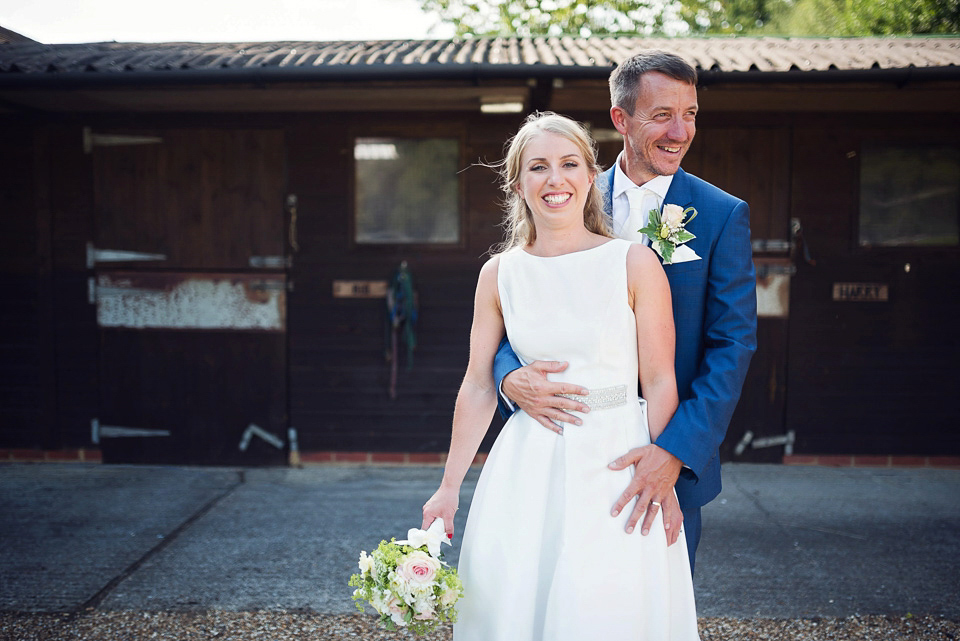 Bride Rosanna wore a Jesus Peiro gown from Miss Bush Bridal in Surrey for her glamorous and romantic English country garden wedding. Photography by Juliet McKee.