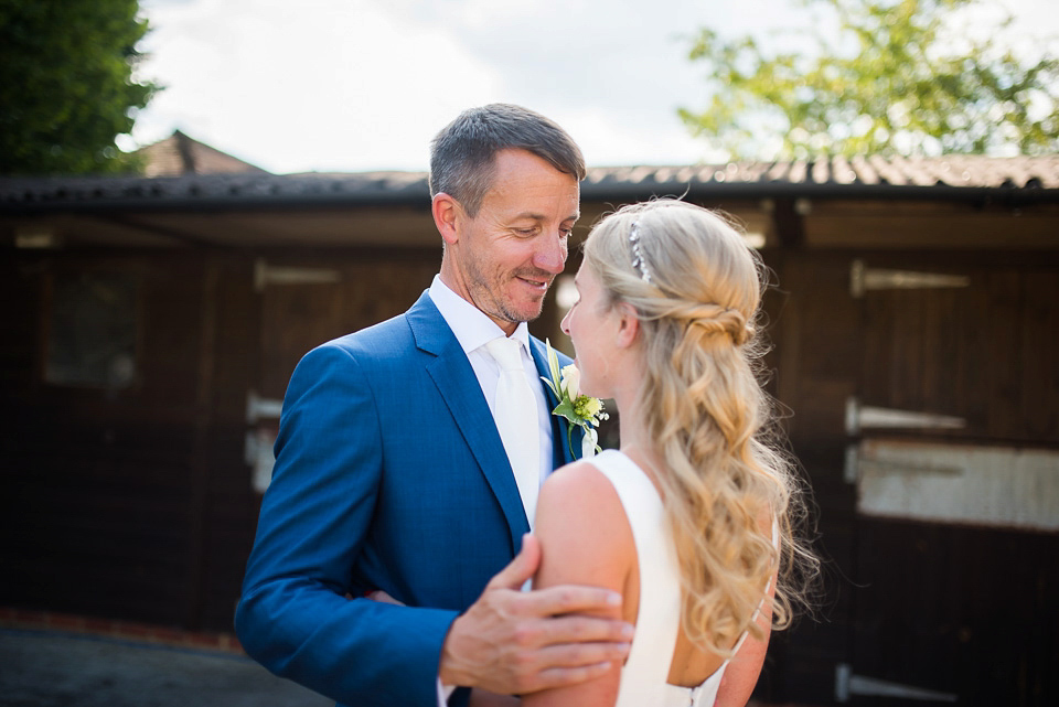 Bride Rosanna wore a Jesus Peiro gown from Miss Bush Bridal in Surrey for her glamorous and romantic English country garden wedding. Photography by Juliet McKee.