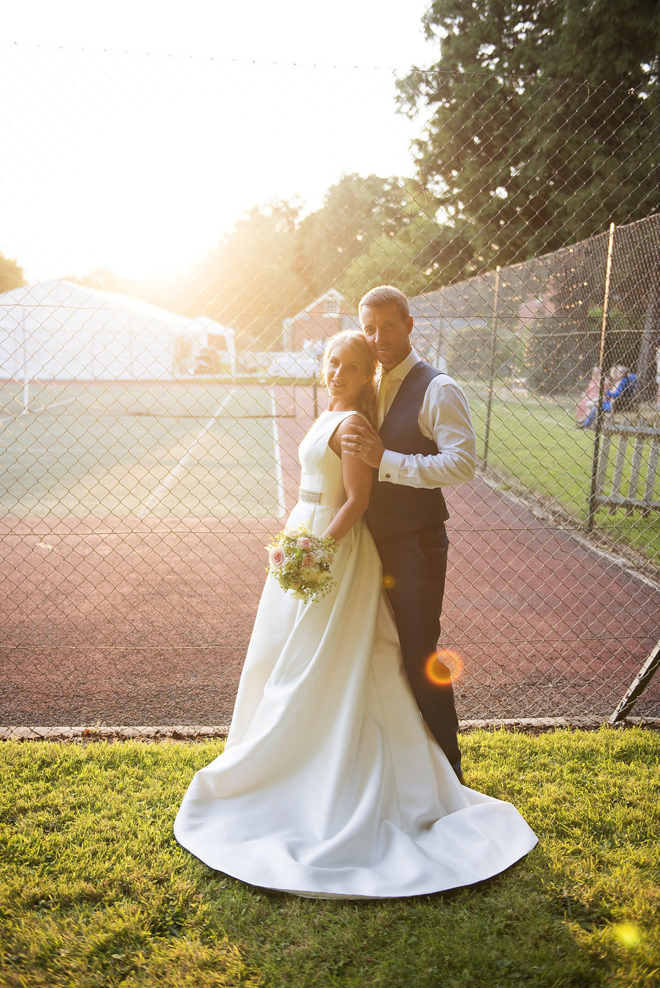 Bride Rosanna wore a Jesus Peiro gown from Miss Bush Bridal in Surrey for her glamorous and romantic English country garden wedding. Photography by Juliet McKee.