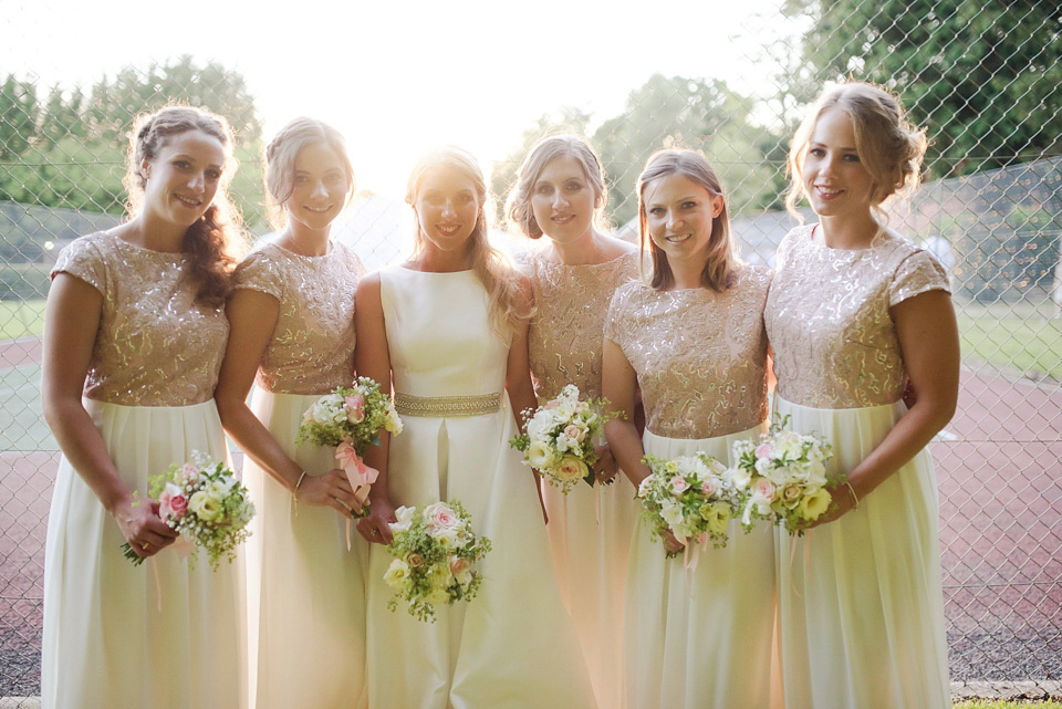 Bride Rosanna wore a Jesus Peiro gown from Miss Bush Bridal in Surrey for her glamorous and romantic English country garden wedding. Photography by Juliet McKee.