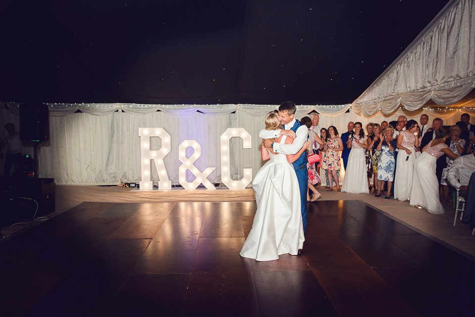 Bride Rosanna wore a Jesus Peiro gown from Miss Bush Bridal in Surrey for her glamorous and romantic English country garden wedding. Photography by Juliet McKee.
