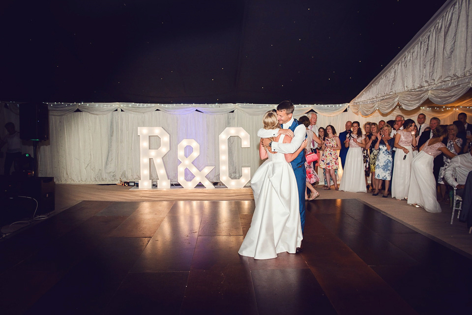 Bride Rosanna wore a Jesus Peiro gown from Miss Bush Bridal in Surrey for her glamorous and romantic English country garden wedding. Photography by Juliet McKee.