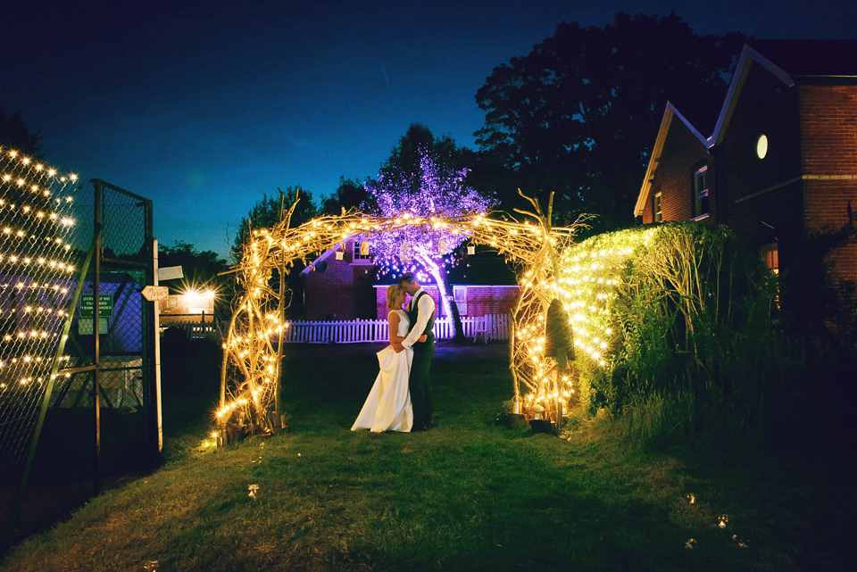 Bride Rosanna wore a Jesus Peiro gown from Miss Bush Bridal in Surrey for her glamorous and romantic English country garden wedding. Photography by Juliet McKee.