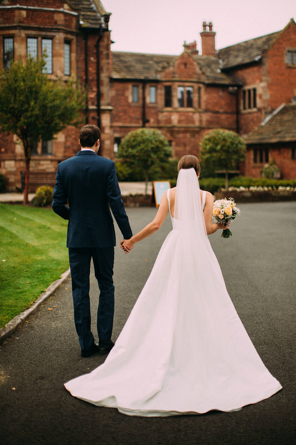 Bride Jo wore a Caroline Castigliano gown with pockets - a purchase from Agapé Bridal Boutique. Photography by The Lawsons.