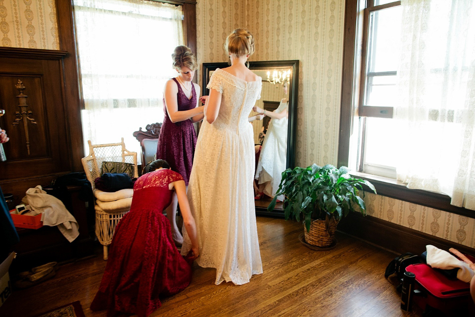 Bride Caitlin wore her Grandmother's 1950's original vintage wedding dress. She also shared a first look before the ceremony with her husband Dustin. Photography by Crystal+Zoe.
