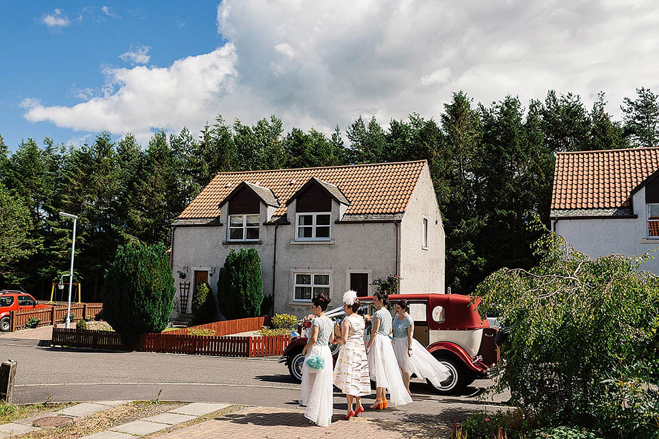 Audrey wore a 1950's inspired tiered wedding dress by Mooshki Bridal for her outdoor wedding in Scotland. The colourful and quirky wedding ceremony was held within the ruins of a chapel. Photography by Paul Joseph.