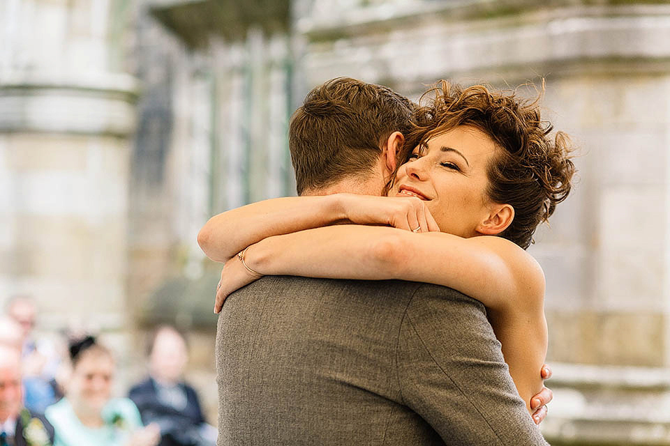 Audrey wore a 1950's inspired tiered wedding dress by Mooshki Bridal for her outdoor wedding in Scotland. The colourful and quirky wedding ceremony was held within the ruins of a chapel. Photography by Paul Joseph.