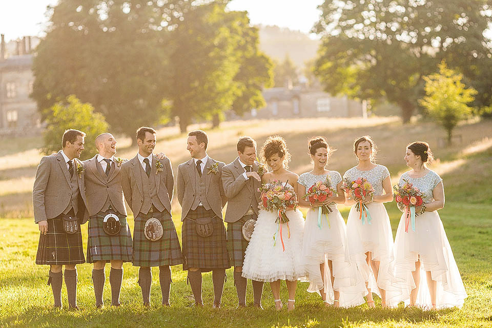 Audrey wore a 1950's inspired tiered wedding dress by Mooshki Bridal for her outdoor wedding in Scotland. The colourful and quirky wedding ceremony was held within the ruins of a chapel. Photography by Paul Joseph.