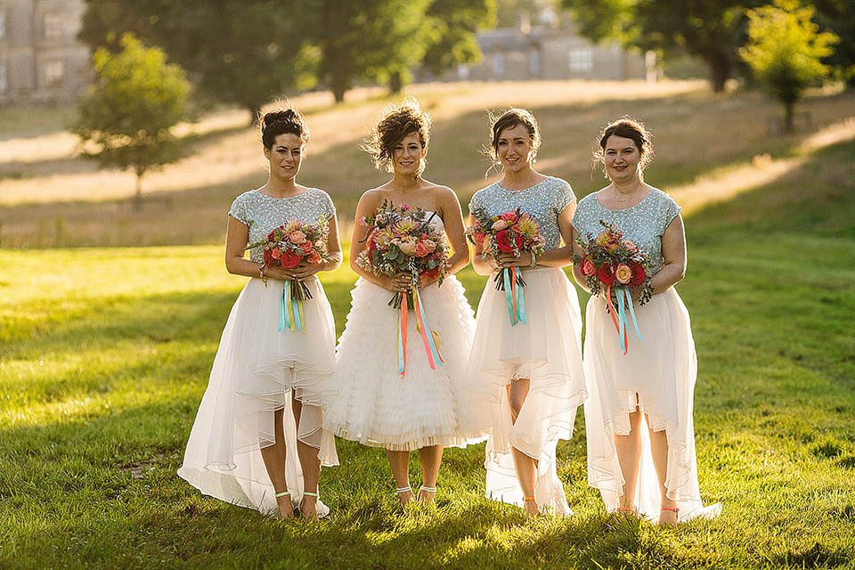 Audrey wore a 1950's inspired tiered wedding dress by Mooshki Bridal for her outdoor wedding in Scotland. The colourful and quirky wedding ceremony was held within the ruins of a chapel. Photography by Paul Joseph.