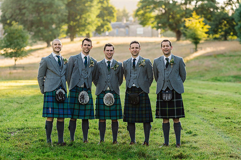 Audrey wore a 1950's inspired tiered wedding dress by Mooshki Bridal for her outdoor wedding in Scotland. The colourful and quirky wedding ceremony was held within the ruins of a chapel. Photography by Paul Joseph.