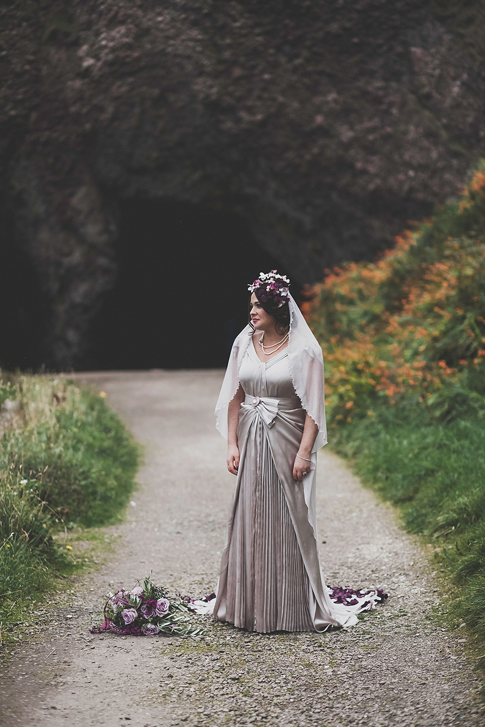 Tara wore a pleated dress in silk with a floral veil for her beautiful coastal wedding at Cushendall Golf Club in Northern Ireland. Photography by Mary McQuillan.